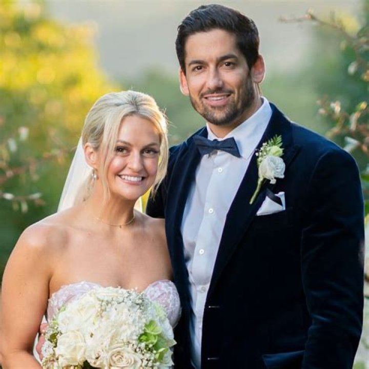 Alyssa and Duncan pose for photo on wedding day