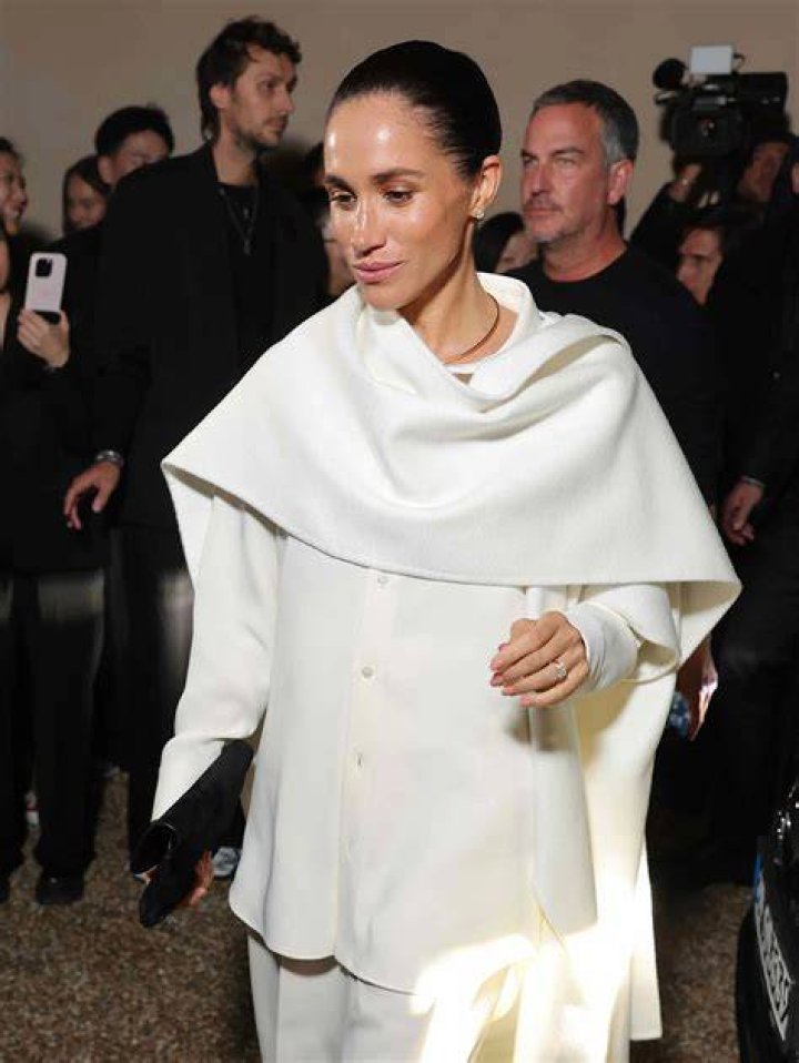 Meghan Markle wearing a stunning backless khaki dress in 2018