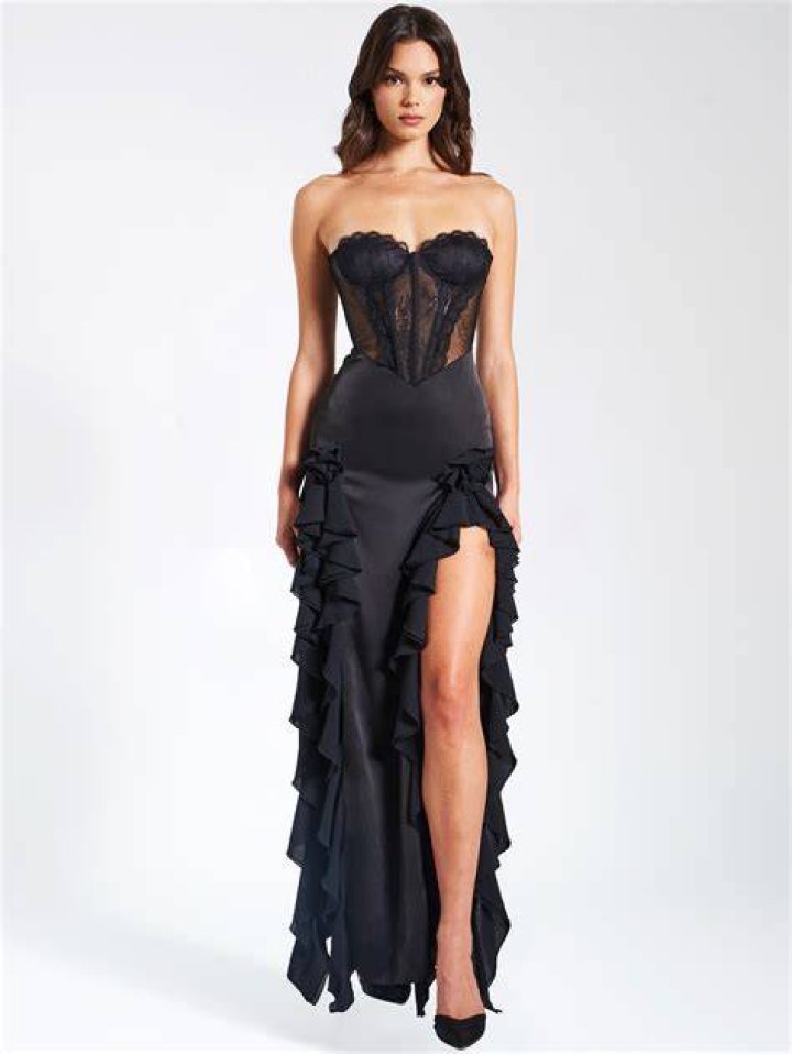 model wears a lace corset top with thin straps
