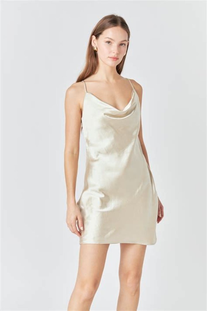 model wears an ivory satin bias cut skirt