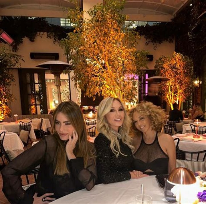 Sofia Vergara at table in restaurant with Anastasia and friend